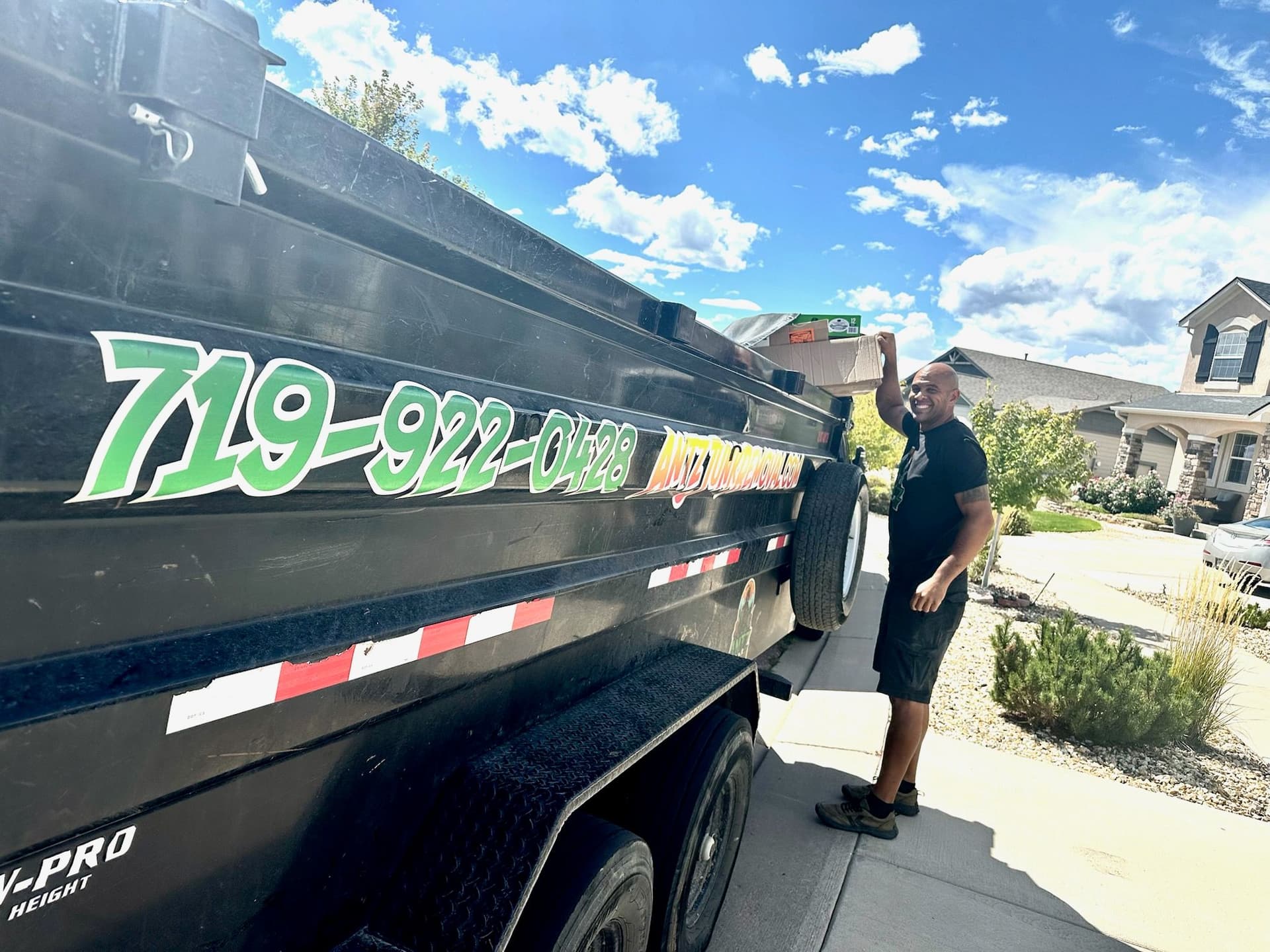 Antz Junk Removal Bringing Sunshine to Declutter image